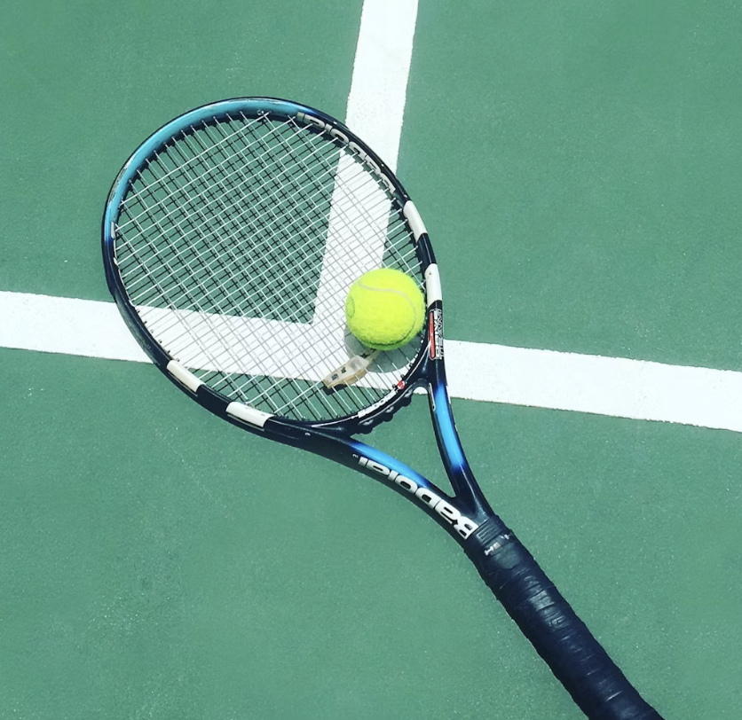 Tennis racket and ball on a tennis court